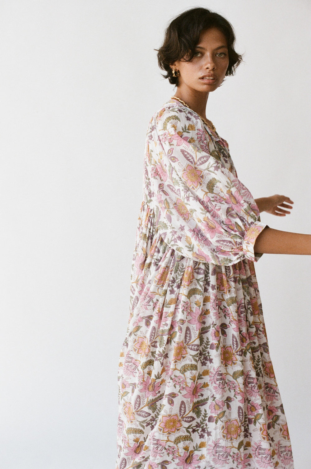 Daughters of India Kyra Maxi Dress in Fuchsia Bloom — studio side profile, billowed sleeve and gathered waist detail