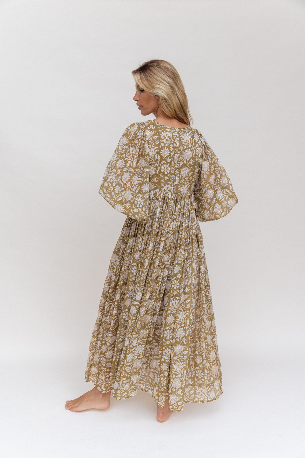 Daughters of India Kyra Maxi Dress in Olive — studio back view turning, gathered waist and flowing hand screen print skirt