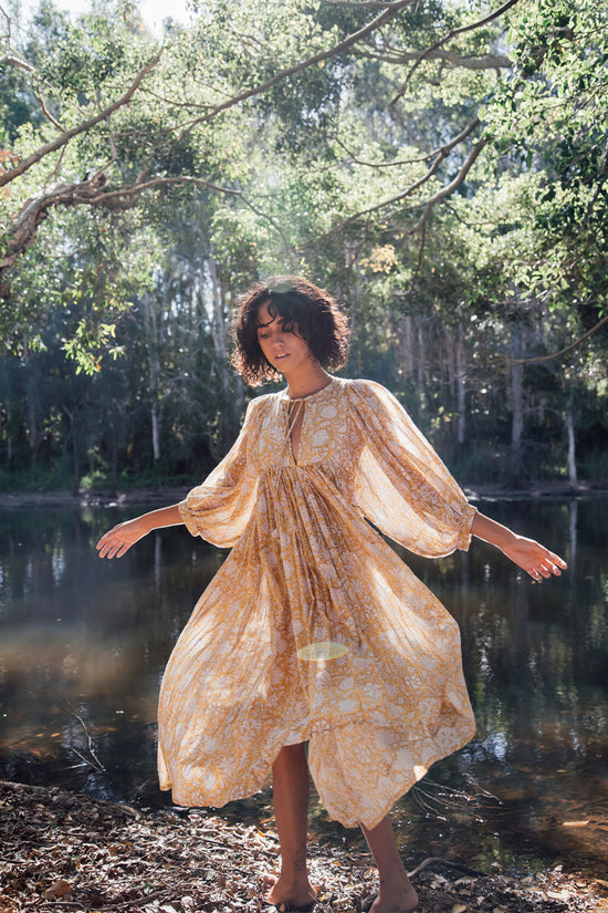 Daughters of India Kyra Midi Dress in Cumin — twirling by forest creek, billowed sleeves, flowing hand screen print skirt
