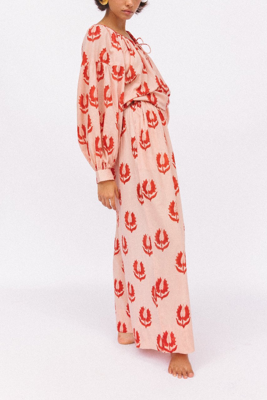 Ria Pants Cherry Blossom — studio side view detail, model wearing cherry blossom hand block print cotton wide-leg pants with coordinating blouse, pink floral motif, artisan Jaipur India | Daughters of India